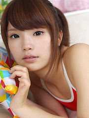 Manami Sato Asian with sexy curves in bath suit plays with pillow